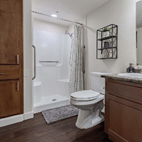A bathroom with a toilet, sink, and shower. AI generated content